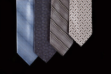 neckties isolated against black