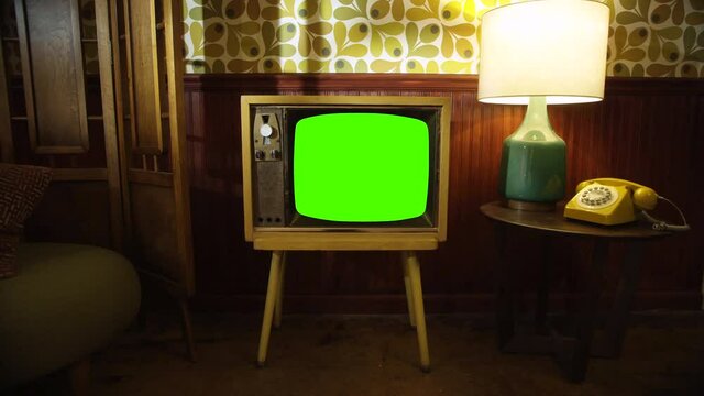 TV screen green screen, Vintage Television Set Green Background with Noise and Static. Zoom Out. You can replace green screen with the footage or picture