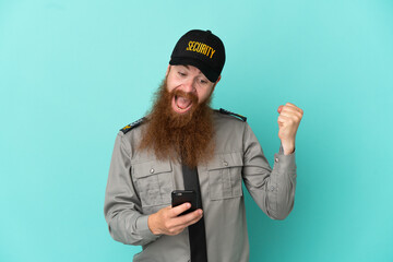 Redhead security man isolated on white background surprised and sending a message