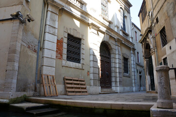 Tourist atmosphere of ancient Venice - the city of canals, gondolas and ancient architecture