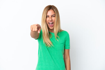 Blonde Uruguayan girl isolated on white background frustrated and pointing to the front