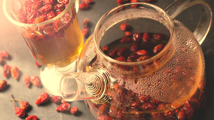 Hot rosehip drink in a glass teapot, vintage