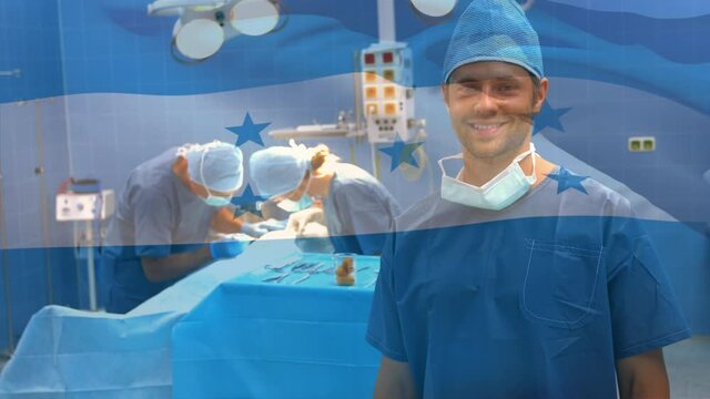 Animation of flag of honduras waving over surgeons in operating theatre
