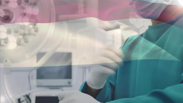 Animation of flag of netherlands waving over surgeon in operating theatre