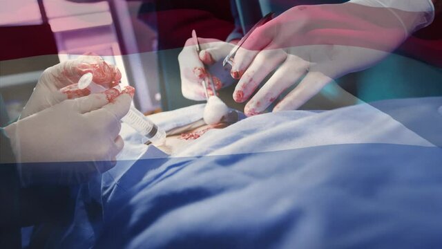 Animation of flag of netherlands waving over surgeons in operating theatre