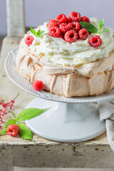 Homemade Pavlova cake with raspberries and mascarpone.