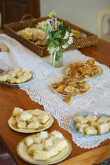 table decorated with tablecloth vase and sweet plates with focus on one with turkish dessert baklava