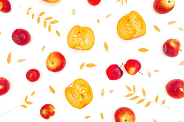Autumnal composition. Fall leaves with apple and sliced pumpkin on white background. Thanksgiving day concept with fall leaves. Flat lay