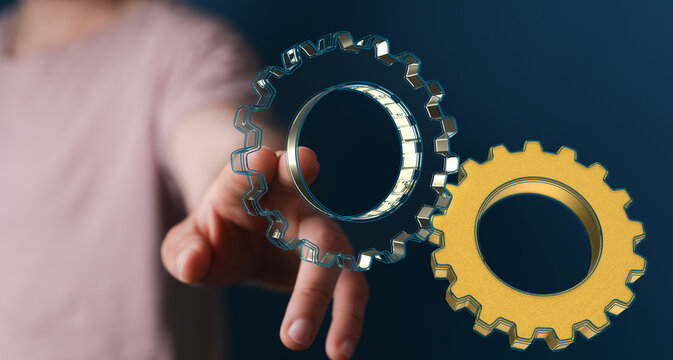 Man draws gears on virtual screen. Blurred Abstract engine room..