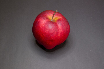 Red apples on black background
