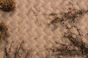 The dried flower arrangement has sugar on the patterned space.