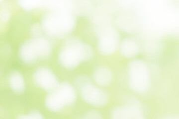 green background and white blurred bokeh  light effect.