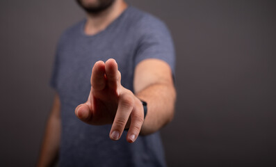 Businessman pointing or touching finger in screen..