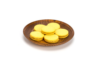 Stuffed cookies in a wooden plate isolated on a white background
