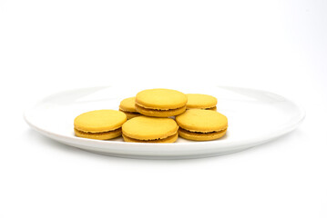 Stuffed cookies in dish isolated on a white background.