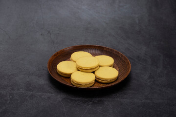 cookies in a plate, on a black background.