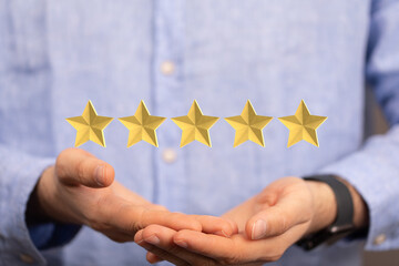 Customer hand touching to yellow illustration 5 stars virtual screening monitor for satisfaction...