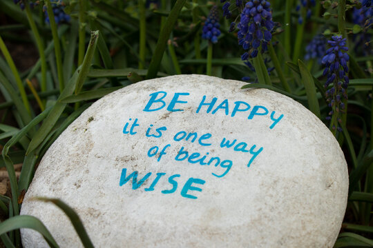 Inspirational Quote On Stone Be Happy