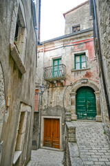 Fototapeta na wymiar The facade of old houses in Cusano Mutri, a medieval town of Benevento province, Italy.