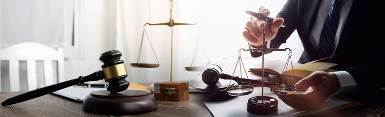 justice and law concept.Male judge in a courtroom on wooden table and Counselor or Male lawyer...