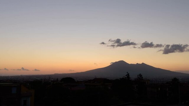 Angri, Italy. July 15th, 2021. View of Mount Vesuvius at sunset with the switching on of the night lights.