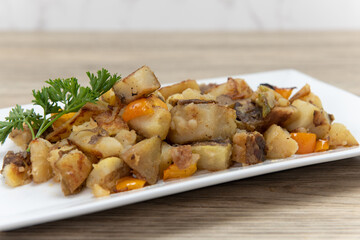 Seasoned plate of o'brien potatoes as a side order to a hearty breakfast in the morning