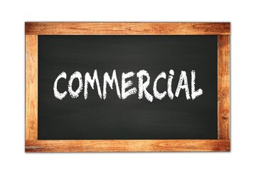 Obraz premium COMMERCIAL text written on wooden frame school blackboard.