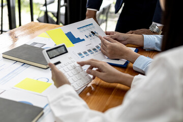 Meeting room atmosphere of a startup company, the finance department is meeting with executives to present financial programs, brainstorming sessions. Concept of company financial management.