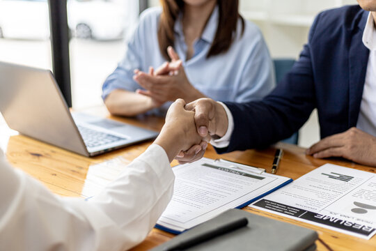 Managers and job applicants shake hands after the job interview, job interviews to find people to work with the company and talent to work with. Concept of recruitment and job interviews.