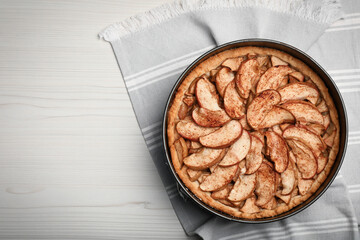 Delicious apple pie on white wooden table, top view. Space for text