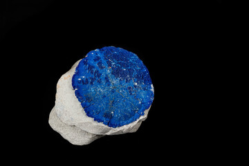 Macro mineral stone Azurite in siltstone against black background