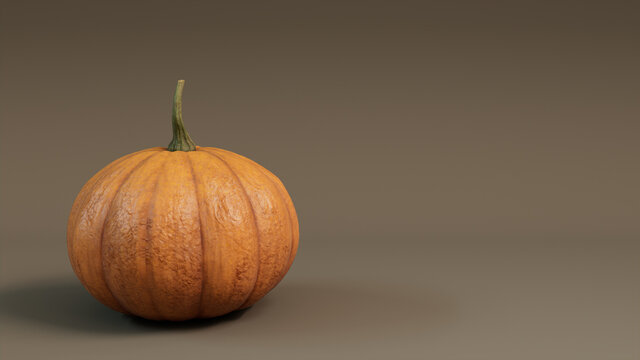 Pumpkin on a Mid Brown colored background. Fall themed Image with copy-space.