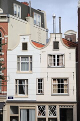 Obraz premium White Twin Canal House Facades with Bell Gables in Amsterdam, Holland