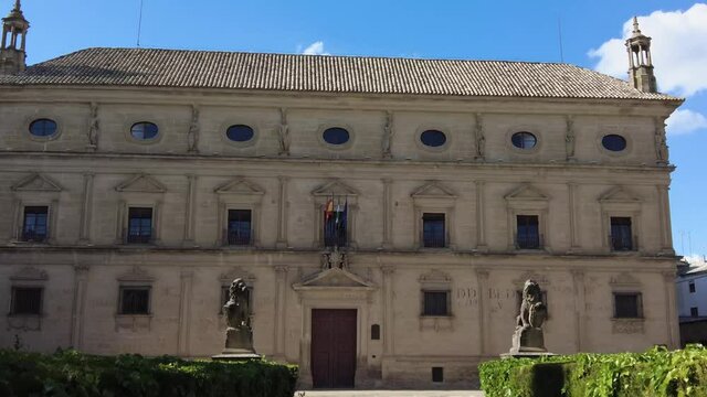 A dolly shot of the facade of Vazquez de Molina Palace on a sunnyin 4K