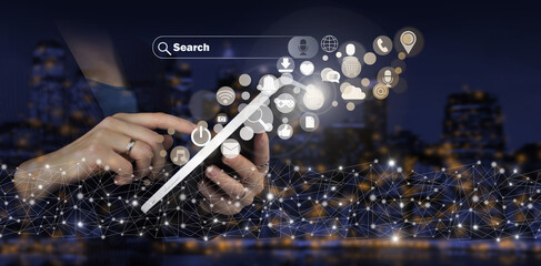 Social media concept. Communication network. Hand touch white tablet with digital hologram social media icons sign on city dark blurred background. Social media or social network notification.