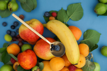 fruits and vegetables with golden spoon