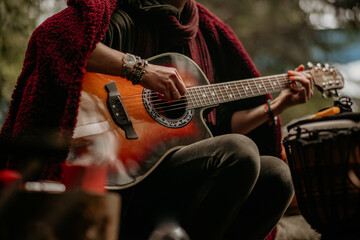 Guitar in hand. Close-up. Rest at nature