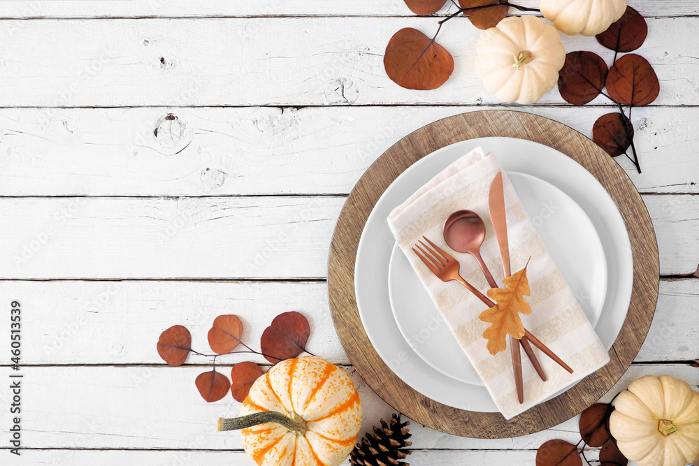 Poster autumn harvest or thanksgiving dinner table setting with plates, flatware, napkin and fall decor. ov