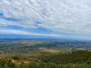 Fototapeta na wymiar Panoramic view of Alazani valley and Caucasus Mountains from Sighnaghi, Kakheti, Georgia