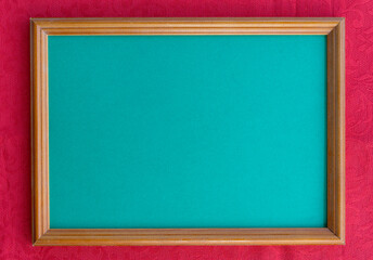 Blank photo frame on pastel blue background. Flat lay, top view, copy space