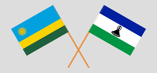 Crossed flags of Rwanda and Kingdom of Lesotho. Official colors. Correct proportion