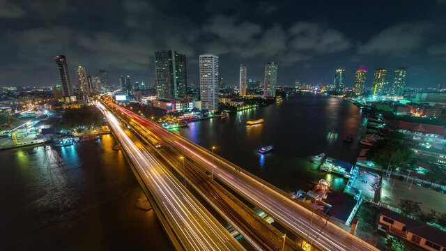 night time illumination bangkok city famous traffic river bridge hotel bay rooftop panorama 4k timelapse thailand