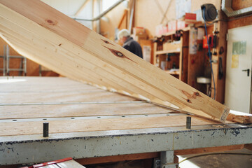 Close up on a slatted wooden frame on a workbench in a workshop