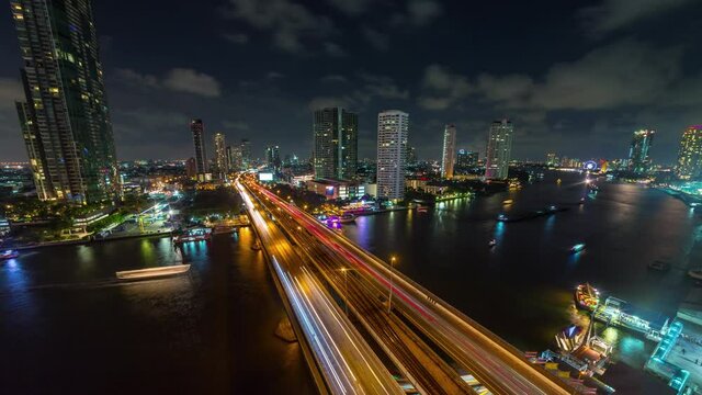 night illumination bangkok city famous traffic river road bridge hotel bay rooftop panorama 4k timelapse thailand