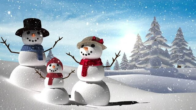 Snow falling over snowman family on winter landscape against blue sky