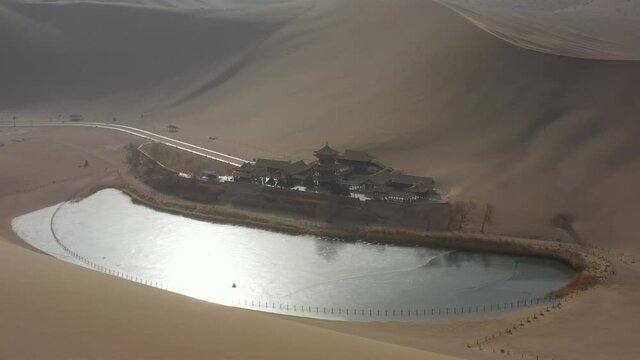 sunny evening time desert dunes old town pond aerial panorama 4k gansu china