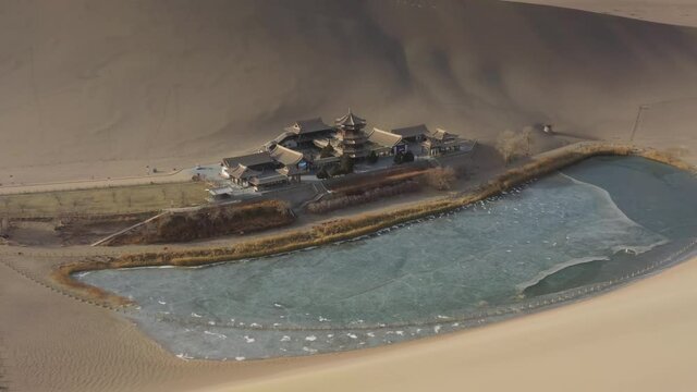 sunny evening time desert dunes old town pond aerial panorama 4k gansu china