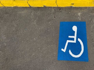 handicap sign painted on the ground