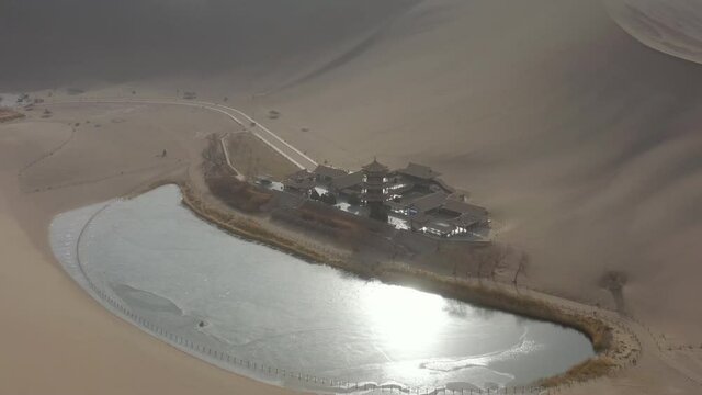 sunny evening time desert dunes old town pond aerial panorama 4k gansu china