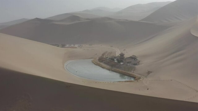 sunny day time desert dunes old town pond aerial panorama 4k gansu china